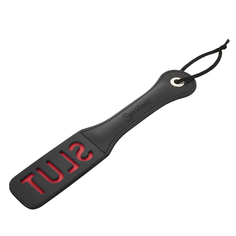 BDSM paddle with word "SLUT"